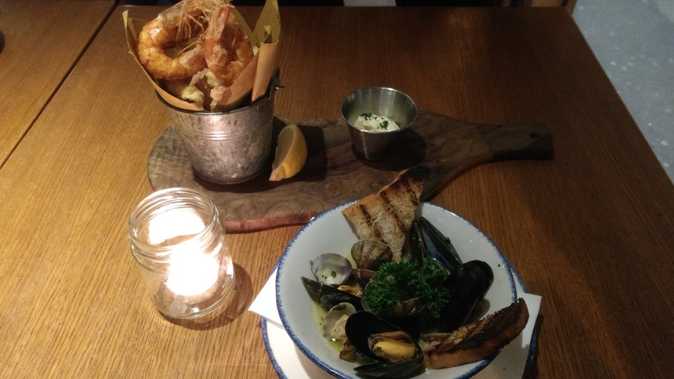 Mussels and clams saute’ in a white wine and deep-fried fresh squid, tiger prawns and garlic mayo
